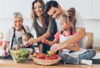 A multi-generational family making dinner together